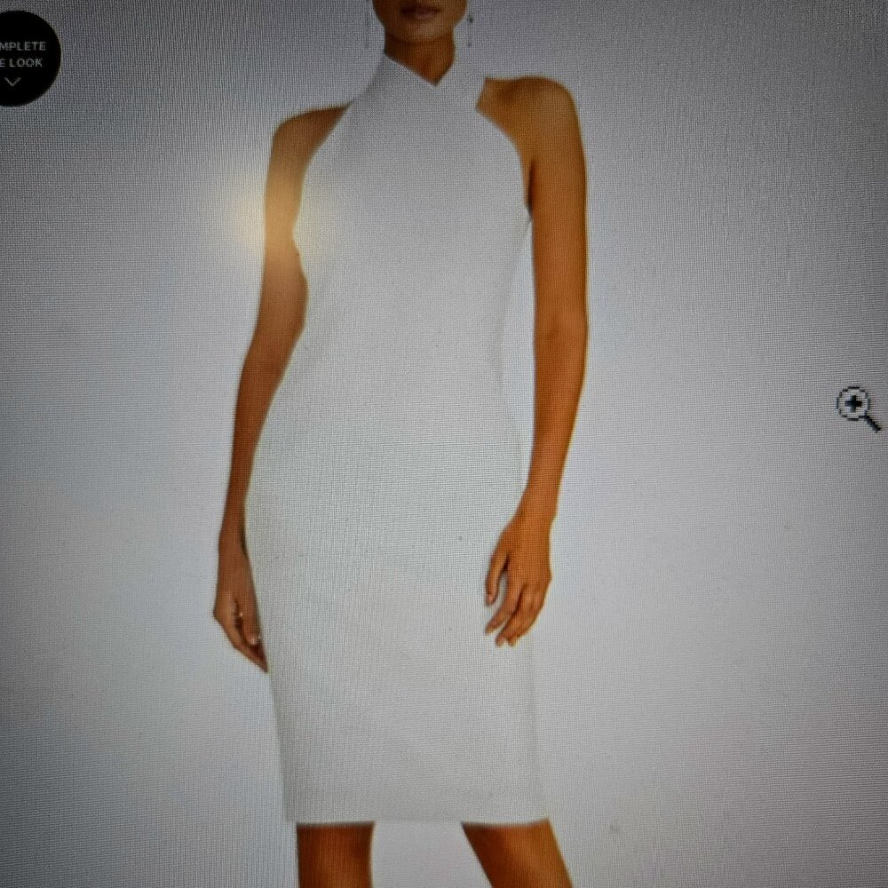 Hugging your curves with a sleek sheath silhouette.